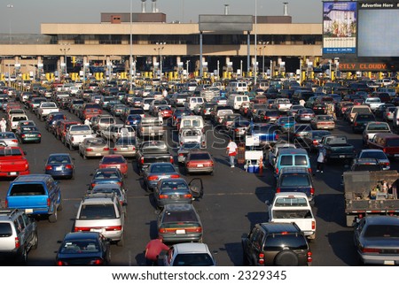 Cars lined up to pass into America from Tijuana Mexico Royalty-Free Stock Photo #2329345
