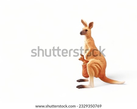 Miniature plastic kangaroo animal with cubs isolated on white