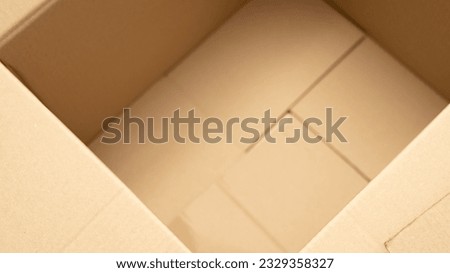 open cardboard boxes close-up, different angles, selective focus, cutout for handle in cardboard box