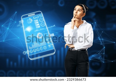 Thoughtful young european businesswoman with digital blue mobile phone and business chart on dark polygonal background. Analytics, financial report and money concept