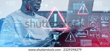 Black man typing in laptop computer, toned image. Red warning system sign alert and glowing digital security with infographics, icons and dashboard. Concept of bug and virus