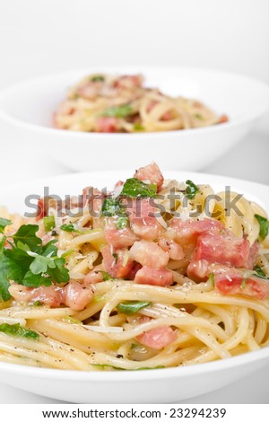 two servings of traditional spaghetti carbonara