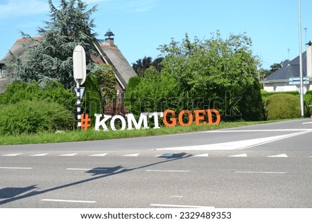 sign with dutch text: Komtgoed ( it will be okay)