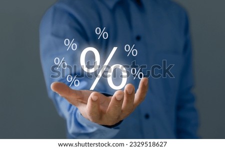 Concept of financial interest rates and dividends provision of financial services.Businessman showing percentage icons and up arrow icons. Interest Rates Stocks Finance Ratings Mortgage Rates.

