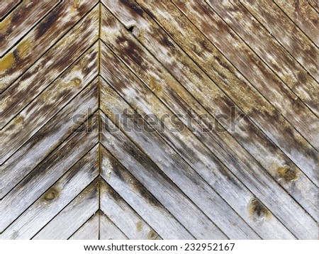 Part of old wooden fence divided into two parts  