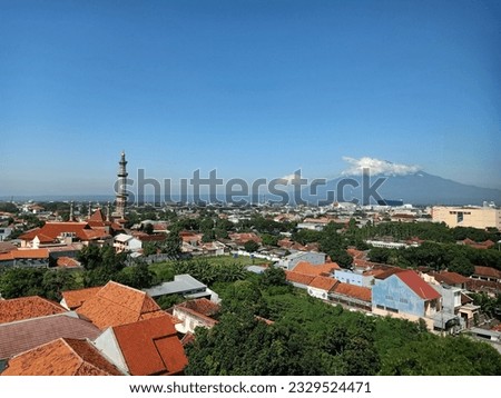 Aerial View of Cirebon City. Viewing of At Taqwa Grand Mosque of Cirebon (Masjid Raya At Taqwa Cirebon and Ciremai Mountain in Back