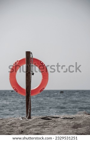 Rescue ring at Falasarna Beach on Crete with an abstract colour scheme Royalty-Free Stock Photo #2329531251