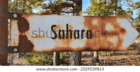 Sign saying the way to Sahara