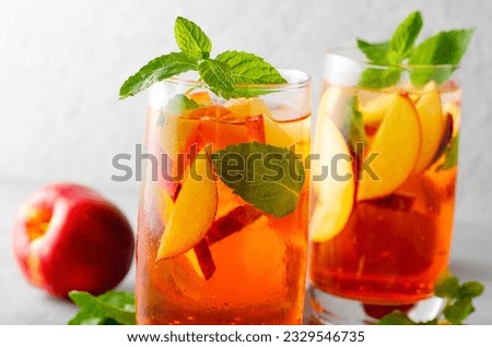 Peach Lemonade, Refreshing Drink, Cocktail, Iced Tea, Tasty Cold Summer Drink on Bright Background
