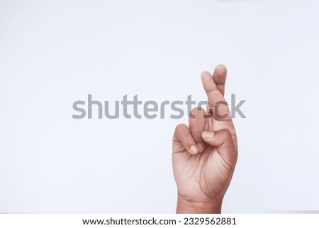 lying down symbol with crossed fingers on white background