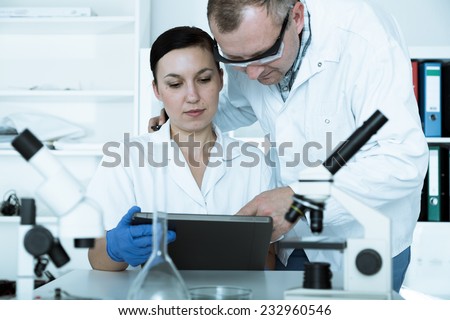 Two scientist in laboratory