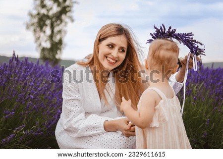 An image of two sisters sitting on a white decorative horse in a lavender field is shown in the picture