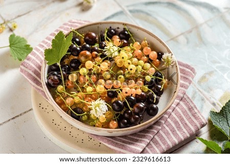 yellow and black currants on a plate. High quality photo
