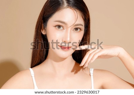 Young Asian beauty woman model long hair with korean makeup style on face and perfect skin on isolated beige background. Facial treatment, Cosmetology, Spa, Aesthetic, plastic surgery. Royalty-Free Stock Photo #2329630017