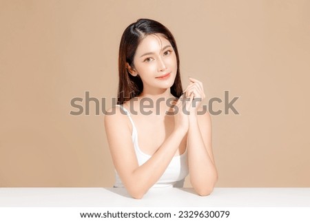 Young Asian beauty woman model long hair with korean makeup style on face and perfect skin on isolated beige background. Facial treatment, Cosmetology, Spa, Aesthetic, plastic surgery. Royalty-Free Stock Photo #2329630079