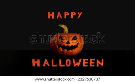 Splash screen Happy Halloween pumpkin lantern with evil grin black background