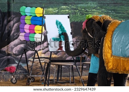 elephant paint elephant. The elephant is an artist painting . Elephant Show in Thailand