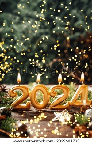 Holiday background Happy New Year 2024. Numbers of year 2024 made by gold burning candles on bokeh festive sparkling background. celebrating New Year holiday, close-up. Space for text Royalty-Free Stock Photo #2329681793