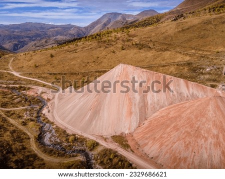 The pinkish hills, the remnants of mining industry in Altai mountains, Russia (aerial photo).