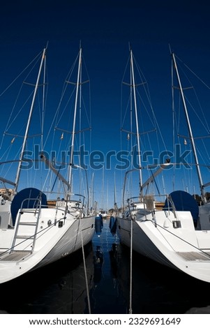 boats anchored in a harbour on a sunny day