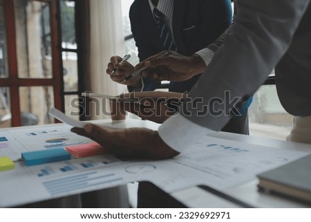 Close up of Business team analyzing income charts and graphs with modern laptop computer. Business analysis and strategy concept.
