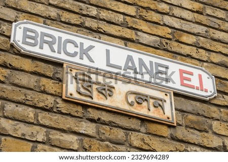 Brick Lane multicultural street sign in East End of London, UK