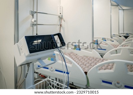 Several empty hospital beds in the hospital. The hospital is preparing for an influx of patients. Covid-19 pandemic. Defocused