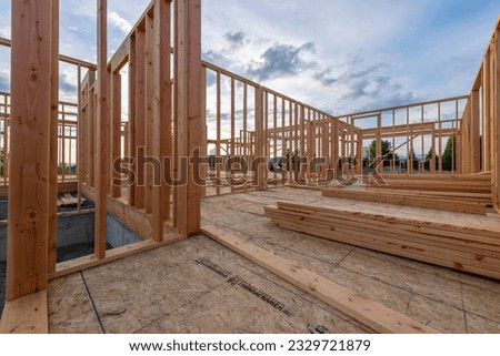 A new construction home framed with no roof or walls at a hilltop upscale subdivision in Spokane, Washington, USA stock photo