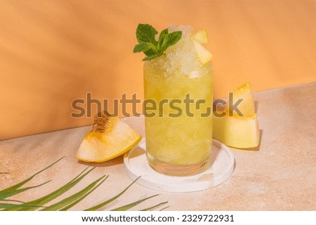 Melon slushie cocktail, Sweet summer refreshing crushed ice slush mocktail with melon juice, milt and lemon or lime