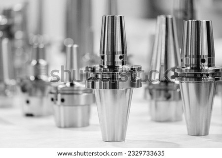 Industrial metalworking concept, milling cutter, metal cutter close up CNC cutters for metal. industry metal processing concept blue tone background Royalty-Free Stock Photo #2329733635