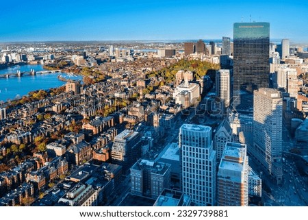 View from the top of the Prudential Tower of Boston's West End, Back Bay, Beacon Hill and Charles River as the sun sets on a clear fall day, 