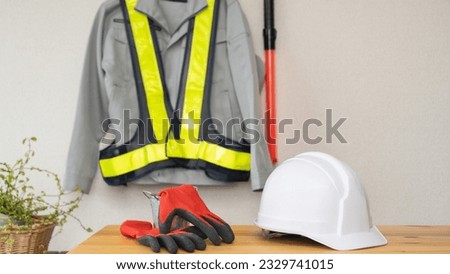 Work clothes hung on the wall.Construction industry image.Security guard image.