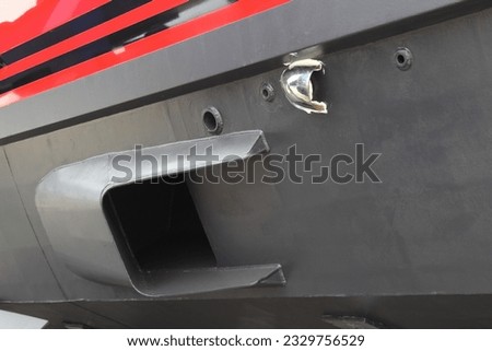 Hull of a luxury motor boat, close-up side view.