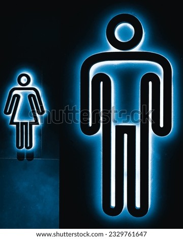 Toilet sign icons depicting gender inequality of women in the background 