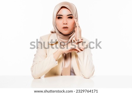 Beautiful and cute Hijab Asian women over studio background.
