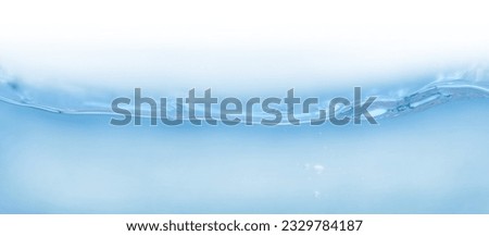 de-focused.Closeup of blue transparent clear calm water surface texture with splashes and bubbles. Trendy abstract summer nature background. for a product, advertising, text space