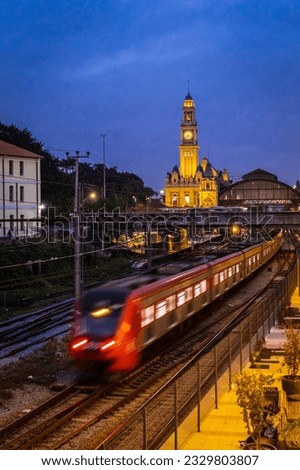 Facade of the historic building headquarters of Luz train Station and the Portuguese Language Museum, with the movement of trains in the maneuvering yard of CPTM, downtown Sao Paulo. Royalty-Free Stock Photo #2329803807