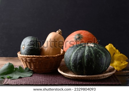 Pumpkin and butternut squash on wooden table with black background, Organic vegetable in Autumn season