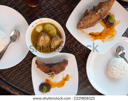 Bali, Indonesia - June 15th 2023 - Photo of Lunch Menu Set from Warung Mak Beng Sanur Bali one of the most historical restaurant in the world opened since 1941  Royalty-Free Stock Photo #2329808325
