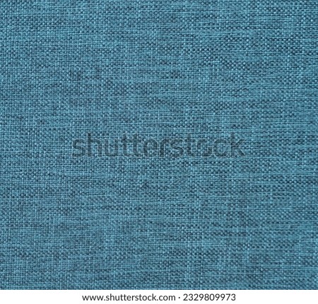 Tosca or teal blue linen synthetic fabric suitable for sofa or upholstery. Background texture, detail. no people.