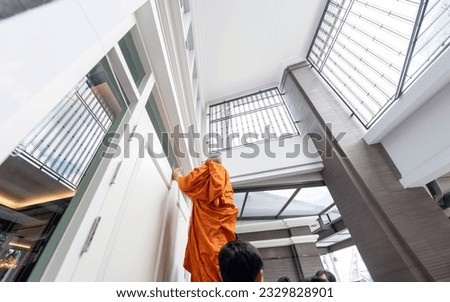 Housewarming ceremony and new company must make Buddhist symbol on main gate by the monks chanting and writing a lucky house.(focus on door) Royalty-Free Stock Photo #2329828901