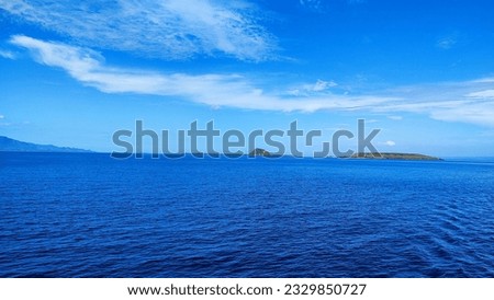 View of the hills with blue sea water from the ship
