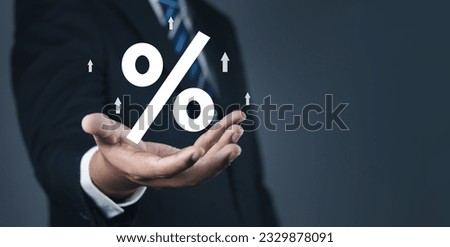 Concept of financial interest rates and dividends provision of financial services.Businessman showing percentage icons and up arrow icons. Interest Rates Stocks Finance Ratings Mortgage Rates.