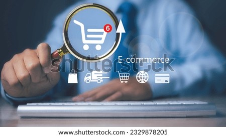 Man using magnifying glass and computer find shopping online. E-commerce marketing business online. Internet Technology, online shopping, business delivery e-commerce, service on the web.