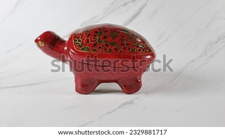 Chinese people believe that turtles are believed to bring good luck, turtle statues are placed in homes with the aim of ensuring the safety and welfare of the home and its owners. Royalty-Free Stock Photo #2329881717