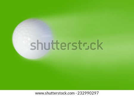 Golf ball high speeds on a green background.