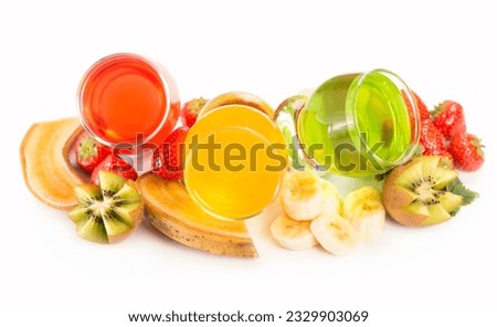 banana jelly, kiwi and strawberry on a white background