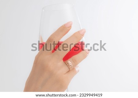 Woman showcases jewelry with a glass of pink drinks. Part images for e-commerce, social media, product sales.