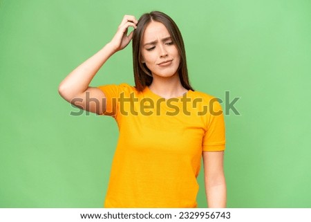 Young pretty caucasian woman over isolated background having doubts while scratching head Royalty-Free Stock Photo #2329956743