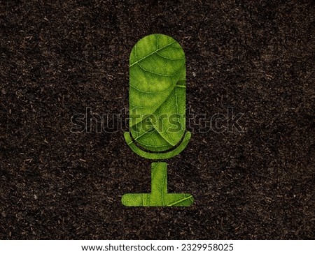 Microphone shape of green leaves on Soil background ecology concept